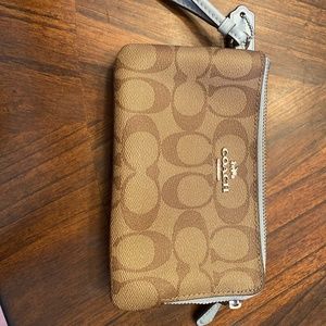 Blue and brown coach wristlet